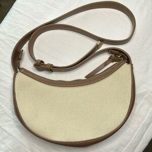 ANTIK KRAFT cream and brown tweed crescent shaped shoulder handbag.